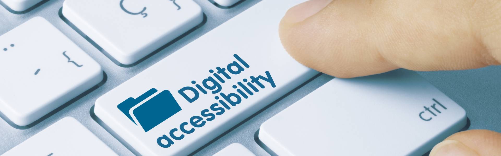 Fingure pressing digital accessibility button on the keyboard